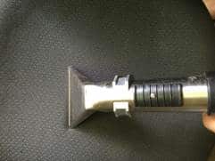 Upholstery cleaning tool on fabric surface